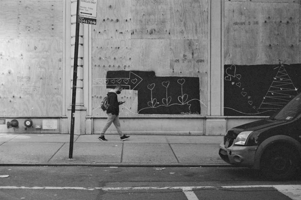 person walking on sidewalk